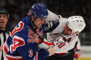NEW YORK - NOVEMBER 17: Aaron Voros #34 of the New York Rangers and Matt Bradley #10 of the Washington Capitals fight during first period action at Madison Square Garden on November 17, 2009 in New York, New York. (Photo by Bruce Bennett/Getty Images)