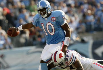 NASHVILLE, TN - NOVEMBER 15:  Quarterback Vince Young #10 of the Tennessee Titans is tackled by Reggie Corner #27 of the Buffalo Bills in their NFL game at LP Field on November 15, 2009 in Nashville, Tennessee.    (Photo by John Sommers II/Getty Images)