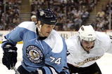 PITTSBURGH, PA - NOVEMBER 16:  Jay McKee #74 of the Pittsburgh Penguins and Joffrey Lupul #14 of the Anaheim Ducks battle for a loose puck in the second period at Mellon Arena on November 16, 2009 in Pittsburgh, Pennsylvania.  (Photo by Justin K. Aller/Getty Images)