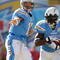 SAN DIEGO - NOVEMBER 01:  Philip Rivers #17 of the San Diego Chargers hands off to LaDainian Tomlinson #21 against the Oakland Raiders during the second quarter at Qualcomm Stadium on November 1, 2009 in San Diego, California.  (Photo by Harry How/Getty Images)