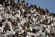 EAST LANSING, MI - SEPTEMBER 21:   Students and fans of Michigan State rally their team during the NCAA football game against Notre Dame at Spartan Stadium in East Lansing, Michigan on September 21, 2002.  The Notre Dame Fighting Irish defeated the Michigan State Spartans 21-17. (Photo by Tom Pidgeon /Getty Images)