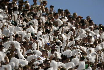 EAST LANSING, MI - SEPTEMBER 21:   Students and fans of Michigan State rally their team during the NCAA football game against Notre Dame at Spartan Stadium in East Lansing, Michigan on September 21, 2002.  The Notre Dame Fighting Irish defeated the Michigan State Spartans 21-17. (Photo by Tom Pidgeon /Getty Images)