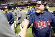 MINNEAPOLIS - OCTOBER 06:  Manger Ron Gardenhire #35 of the Minnesota Twins is congratulated by players after the Twins defeated  the Detroit Tigers to win the American League Tiebreaker game on October 6, 2009 at Hubert H. Humphrey Metrodome in Minneapolis, Minnesota.  (Photo by Jamie Squire/Getty Images)
