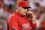 ANAHEIM, CA - OCTOBER 22:  Manager Mike Scioscia of the Los Angeles Angels of Anaheim walks out to the mound during the seventh inning in Game Five of the ALCS against the New York Yankees during the 2009 MLB Playoffs at Angel Stadium on October 22, 2009 in Anaheim, California.  (Photo by Stephen Dunn/Getty Images)