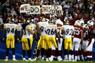 TAMPA, FL - FEBRUARY 01:  Fans hold up a sign as both the Arizona Cardinals and the Pittsburgh Steelers are on the field during Super Bowl XLIII on February 1, 2009 at Raymond James Stadium in Tampa, Florida.  (Photo by Chris McGrath/Getty Images)