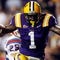BATON ROUGE, LA - NOVEMBER 14:  Brandon LaFell #1 of the LSU Tigers jumps over Jai Eugene #4 of the Louisiana Tech Bulldogs on his way to scoring a touchdown at Tiger Stadium on November 14, 2009 in Baton Rouge, Louisiana.  (Photo by Chris Graythen/Getty Images)