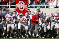 EAST LANSING, MI - OCTOBER 14:  Jim Tressel, head coach of the Ohio State Buckeyes, leads his team onto the field for a game against the Michigan State Spartans on October 14, 2006 at Spartan Stadium in East Lansing, Michigan. Ohio State won the game 38-7.  (Photo by Gregory Shamus/Getty Images)