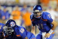 BOISE, ID - SEPTEMBER 3: Quarterback Kellen Moore #6 of the Boise State Broncos barks out signals as center Thomas Byrd #66 of the Boise State Broncos waits to snap the ball in the third quarter of the game against the Oregon Ducks at Bronco Stadium on September 3, 2009 in Boise, Idaho. Boise State won the game 19-8. (Photo by Steve Dykes/Getty Images)