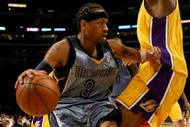LOS ANGELES - NOVEMBER 6: Allen Iverson #3 of the Memphis Grizzlies drives against Josh Powell #21 of the Los Angeles Lakers on November 6, 2009 at Staples Center in Los Angeles, California. The Lakers won 114-98.  NOTE TO USER: User expressly acknowledges and agrees that, by downloading and/or using this Photograph, user is consenting to the terms and conditions of the Getty Images License Agreement. (Photo by Stephen Dunn/Getty Images)