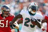 MIAMI GARDENS, FL - NOVEMBER 15:  Running back Ronnie Brown #23 of the Miami Dolphins runs past linebacker Barrett Ruud #51 of the Tampa Bay Buccaneers at Land Shark Stadium on November 15, 2009 in Miami Gardens, Florida.  (Photo by Doug Benc/Getty Images)