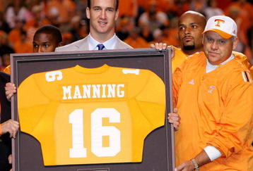 KNOXVILLE, TN - OCTOBER 29:  Former Tennesse quarterback Peyton Manning and current quarterback for the Indianapolis Colts is honored alongside his former college coach Phillip Fulmer before the start of the game against the South Carolina Gamecocks on October 29, 2005 at Neyland Stadium in Knoxville, Tennessee.  (Photo by Streeter Lecka/Getty Images)