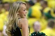 EUGENE, OR - MARCH 8:  A cheerleader of the Oregon Ducks performs during a timeout from the game against the Arizona Wildcats at MacArthur Court March 8, 2008 in Eugene, Oregon.  (Photo by Jonathan Ferrey/Getty Images)