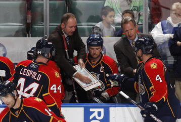 SUNRISE, FL - NOVEMBER 16: Head coach Peter DeBoer of the Florida Panthers goes over a play with Dennis Seidenberg #4 and Jordan Leopold #44 during th eovertime period against the Los Angeles Kings on November 16, 2009 at the BankAtlantic Center in Sunrise, Florida. The Kings defeated the Panthers 4-3. (Photo by Joel Auerbach/Getty Images)
