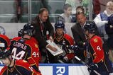SUNRISE, FL - NOVEMBER 16: Head coach Peter DeBoer of the Florida Panthers goes over a play with Dennis Seidenberg #4 and Jordan Leopold #44 during th eovertime period against the Los Angeles Kings on November 16, 2009 at the BankAtlantic Center in Sunrise, Florida. The Kings defeated the Panthers 4-3. (Photo by Joel Auerbach/Getty Images)