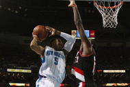 NEW ORLEANS - NOVEMBER 13:  Marcus Thornton #5 of the New Orleans Hornets puts up a shot against Greg Oden #52 of the Portland Trail Blazers during the game at New Orleans Arena on November 13, 2009 in New Orleans, Louisiana.  NOTE TO USER: User expressly acknowledges and agrees that, by downloading and or using this photograph, User is consenting to the terms and conditions of the Getty Images License Agreement. (Photo by Chris Graythen/Getty Images)