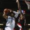 NEW ORLEANS - NOVEMBER 13:  Marcus Thornton #5 of the New Orleans Hornets puts up a shot against Greg Oden #52 of the Portland Trail Blazers during the game at New Orleans Arena on November 13, 2009 in New Orleans, Louisiana.  NOTE TO USER: User expressly acknowledges and agrees that, by downloading and or using this photograph, User is consenting to the terms and conditions of the Getty Images License Agreement. (Photo by Chris Graythen/Getty Images)