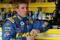 AVONDALE, AZ - NOVEMBER 14:  Jamie McMurray, driver of the #26 Irwin Ford, waits in the garage before practice for the NASCAR Sprint Cup Series Checker O'Reilly Auto Parts 500 at Phoenix International Raceway on November 14, 2009 in Avondale, Arizona.  (Photo by Todd Warshaw/Getty Images for NASCAR)