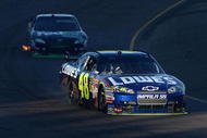 AVONDALE, AZ - NOVEMBER 15:  Jimmie Johnson, driver of the #48 Lowe's Chevrolet, races during the NASCAR Sprint Cup Series Checker O'Reilly Auto Parts 500 at Phoenix International Raceway on November 15, 2009 in Avondale, Arizona.  (Photo by Christian Petersen/Getty Images)
