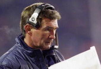 13 Nov 2000:  Head coach Mike Shanahan of the Denver Broncos looks at a play list against the Oakland Raiders in the fourth quarter at Mile High Stadium in Denver, Colorado.  Denver won 27-24.  <DIGITAL IMAGE> Mandatory Credit: Brian Bahr/ALLSPORT
