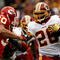 LANDOVER, MD - OCTOBER 18:  Mike Brown #30 of the Kansas City Chiefs tackles Clinton Portis #26 of the Washington Redskins during their game October 18, 2009 at FedEx Field in Landover, Maryland.The Chiefs won the game 14-6.  (Photo by Win McNamee/Getty Images)