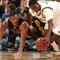 INDIANAPOLIS - MARCH 12:  Manny Harris #3 of the Michigan Wolveriens attempts to control a loose ball against Jarryd Cole #50 of the Iowa Hawkeyes during the first round of the Big Ten Men's Basketball Tournament at Conseco Fieldhouse on March 12, 2009 in Indianapolis, Indiana.  (Photo by Jonathan Daniel/Getty Images)