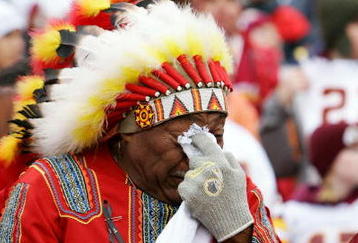 LANDOVER, MD - DECEMBER 02:  Washington Redskins fan 'Chief Zee' fights back tears during a pre game ceremony honoring the late Sean Taylor before the game against the Buffalo Bills on December 2, 2007 at FedEx Field in Landover, Maryland.  (Photo by Jim McIsaac/Getty Images)