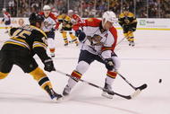 BOSTON - NOVEMBER 12:  Stephen Weiss #9 of the Florida Panthers tries to keep the puck from Mark Stuart #45 of the Boston Bruins on November 12, 2009 at the TD Garden in Boston, Massachusetts.  (Photo by Elsa/Getty Images)