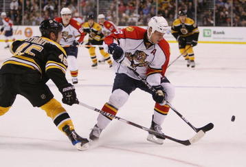 BOSTON - NOVEMBER 12:  Stephen Weiss #9 of the Florida Panthers tries to keep the puck from Mark Stuart #45 of the Boston Bruins on November 12, 2009 at the TD Garden in Boston, Massachusetts.  (Photo by Elsa/Getty Images)