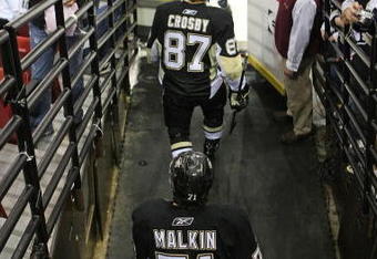 PITTSBURGH - MAY 11:  Sidney Crosby #87 and Evgeni Malkin #71 of the Pittsburgh Penguins skate out for warmups prior to their game against the Washington Capitals in Game Six of the Eastern Conference Semifinal Round of the 2009 Stanley Cup Playoffs at Mellon Arena on May 11, 2009 in Pittsburgh, Pennsylvania.  (Photo by Bruce Bennett/Getty Images)