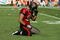 MIAMI GARDENS, FL - NOVEMBER 15:  Linebacker Niko Koutouvides #53 of the Tampa Bay Buccaneers reacts after failing to make a tackle against the Miami Dolphins at Land Shark Stadium on November 15, 2009 in Miami Gardens, Florida.  (Photo by Doug Benc/Getty Images)