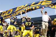 ANN ARBOR, MI - SEPTEMBER 05:  Head coach Rich Rodriguez enters the stadium with his team prior to playing the Western Michigan Broncos on September 5, 2009 at Michigan Stadium in Ann Arbor, Michigan.  (Photo by Gregory Shamus/Getty Images)