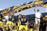 ANN ARBOR, MI - SEPTEMBER 05:  Head coach Rich Rodriguez enters the stadium with his team prior to playing the Western Michigan Broncos on September 5, 2009 at Michigan Stadium in Ann Arbor, Michigan.  (Photo by Gregory Shamus/Getty Images)