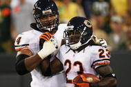 GREEN BAY, WI - SEPTEMBER 13: Chris Williams #74 of the Chicago Bears congratulates teammate Devin Hester #23 after Hester caught a downtouch pass in the 3rd quarter against the Green Bay Packers on September 13, 2009 at Lambeau Field in Green Bay, Wisconsin. The Packers defeated the Bears 21-15. (Photo by Jonathan Daniel/Getty Images)