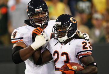 GREEN BAY, WI - SEPTEMBER 13: Chris Williams #74 of the Chicago Bears congratulates teammate Devin Hester #23 after Hester caught a downtouch pass in the 3rd quarter against the Green Bay Packers on September 13, 2009 at Lambeau Field in Green Bay, Wisconsin. The Packers defeated the Bears 21-15. (Photo by Jonathan Daniel/Getty Images)