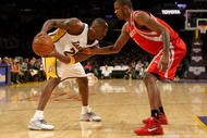 LOS ANGELES - NOVEMBER 15:  Kobe Bryant #24 of the Los Angeles Lakers controls the ball against Trevor Ariza #1 of the Houston Rockets on November 15, 2009 at Staples Center in Los Angeles, California.  The Rockets won 101-91.  NOTE TO USER: User expressly acknowledges and agrees that, by downloading and/or using this Photograph, user is consenting to the terms and conditions of the Getty Images License Agreement.   (Photo by Stephen Dunn/Getty Images)