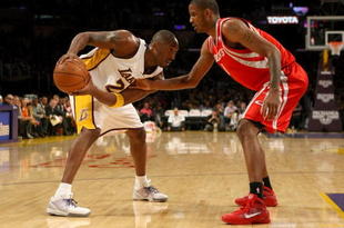 LOS ANGELES - NOVEMBER 15:  Kobe Bryant #24 of the Los Angeles Lakers controls the ball against Trevor Ariza #1 of the Houston Rockets on November 15, 2009 at Staples Center in Los Angeles, California.  The Rockets won 101-91.  NOTE TO USER: User expressly acknowledges and agrees that, by downloading and/or using this Photograph, user is consenting to the terms and conditions of the Getty Images License Agreement.   (Photo by Stephen Dunn/Getty Images)