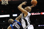 SAN ANTONIO - NOVEMBER 11:  Shawn Marion #0 of the Dallas Mavericks fouls Richard Jefferson #24 of the San Antonio Spurs in the act of shooting during second quarter of action at AT&T Center on November 11, 2009 in San Antonio, Texas.  NOTE TO USER: User expressly acknowledges and agrees that, by downloading and or using this photograph, User is consenting to the terms and conditions of the Getty Images License Agreement. (Photo by Ronald Martinez/Getty Images)
