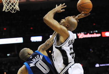 SAN ANTONIO - NOVEMBER 11:  Shawn Marion #0 of the Dallas Mavericks fouls Richard Jefferson #24 of the San Antonio Spurs in the act of shooting during second quarter of action at AT&T Center on November 11, 2009 in San Antonio, Texas.  NOTE TO USER: User expressly acknowledges and agrees that, by downloading and or using this photograph, User is consenting to the terms and conditions of the Getty Images License Agreement. (Photo by Ronald Martinez/Getty Images)