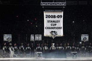 PITTSBURGH - OCTOBER 2: The Pittsburgh Penguins raise their Stanley Cup Champions banner in a ceremony before a game against the New York Rangers on October 2, 2009 at Mellon Arena in Pittsburgh, Pennsylvania. Pittsburgh defeated New York 3-2.  (Photo by Jamie Sabau/Getty Images)
