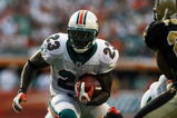 MIAMI - OCTOBER 25:  Running back Ronnie Brown #23 of the Miami Dolphins looks for room to run against the New Orleans Saints at Land Shark Stadium on October 25, 2009 in Miami, Florida.  (Photo by Doug Benc/Getty Images)