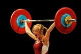 MELBOURNE, AUSTRALIA - MARCH 16:  Marilou Dozois-Prevost of Canada celebrates as she makes a lift in the Snatch category during the weightlifting Women's 48kg Final at the Melbourne Exhibition Centre during day one of the Melbourne 2006 Commonwealth Games March 16, 2006 in Melbourne, Australia.  (Photo by Cameron Spencer/Getty Images)