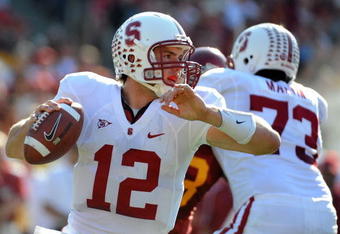 LOS ANGELES, CA - NOVEMBER 14:  Andrew Luck #12 of the Stanford Cardinal scrambles in the pocket against the USC Trojans during the first half at the Los Angeles Memorial Coliseum on November 14, 2009 in Los Angeles, California.  (Photo by Harry How/Getty Images)