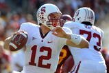 LOS ANGELES, CA - NOVEMBER 14:  Andrew Luck #12 of the Stanford Cardinal scrambles in the pocket against the USC Trojans during the first half at the Los Angeles Memorial Coliseum on November 14, 2009 in Los Angeles, California.  (Photo by Harry How/Getty Images)