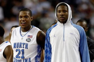 DETROIT - APRIL 06: Deon Thompson #21 and Ed Davis #32 of the North Carolina Tar Heels look on from the bench late in the second half before the Tar Heels 89-72 win against the Michigan State Spartans during the 2009 NCAA Division I Men's Basketball National Championship game at Ford Field on April 6, 2009 in Detroit, Michigan. Ginyard used a medical red-shirt this season after injury. (Photo by Andy Lyons/Getty Images)