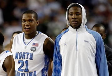 DETROIT - APRIL 06:  Deon Thompson #21 and Ed Davis #32 of the North Carolina Tar Heels look on from the bench late in the second half before the Tar Heels 89-72 win against the Michigan State Spartans during the 2009 NCAA Division I Men's Basketball National Championship game at Ford Field on April 6, 2009 in Detroit, Michigan. Ginyard used a medical red-shirt this season after injury.  (Photo by Andy Lyons/Getty Images)