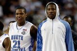 DETROIT - APRIL 06:  Deon Thompson #21 and Ed Davis #32 of the North Carolina Tar Heels look on from the bench late in the second half before the Tar Heels 89-72 win against the Michigan State Spartans during the 2009 NCAA Division I Men's Basketball National Championship game at Ford Field on April 6, 2009 in Detroit, Michigan. Ginyard used a medical red-shirt this season after injury.  (Photo by Andy Lyons/Getty Images)