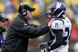 ANN ARBOR, MI - OCTOBER 28:  Head coach Pat Fitzgerald of the Northwestern Wildcats talks with Kevin Mitchell #24 during a game against the Michigan Wolverines on October 28, 2006 at Michigan Stadium in Ann Arbor, Michigan. Michigan defeated Northwestern 17-3.  (Photo by Gregory Shamus/Getty Images)