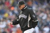 DENVER - OCTOBER 11:  Jim Tracy #4 of the Colorado Rockies walks to the dugout after a discussion with the first base umpire against the Philadelphia Phillies in Game Four of the NLDS during the 2009 MLB Playoffs at Coors Field on October 12, 2009 in Denver, Colorado.  (Photo by Jed Jacobsohn/Getty Images)