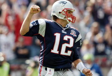 FOXBORO, MA - OCTOBER 04:  Tom Brady #12 of the New England Patriots celebrates a touchdown run in the second quarter against the Baltimore Ravens on October 4, 2009 at Gillette Stadium in Foxboro, Massachusetts.  (Photo by Elsa/Getty Images)