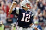 FOXBORO, MA - OCTOBER 04:  Tom Brady #12 of the New England Patriots celebrates a touchdown run in the second quarter against the Baltimore Ravens on October 4, 2009 at Gillette Stadium in Foxboro, Massachusetts.  (Photo by Elsa/Getty Images)